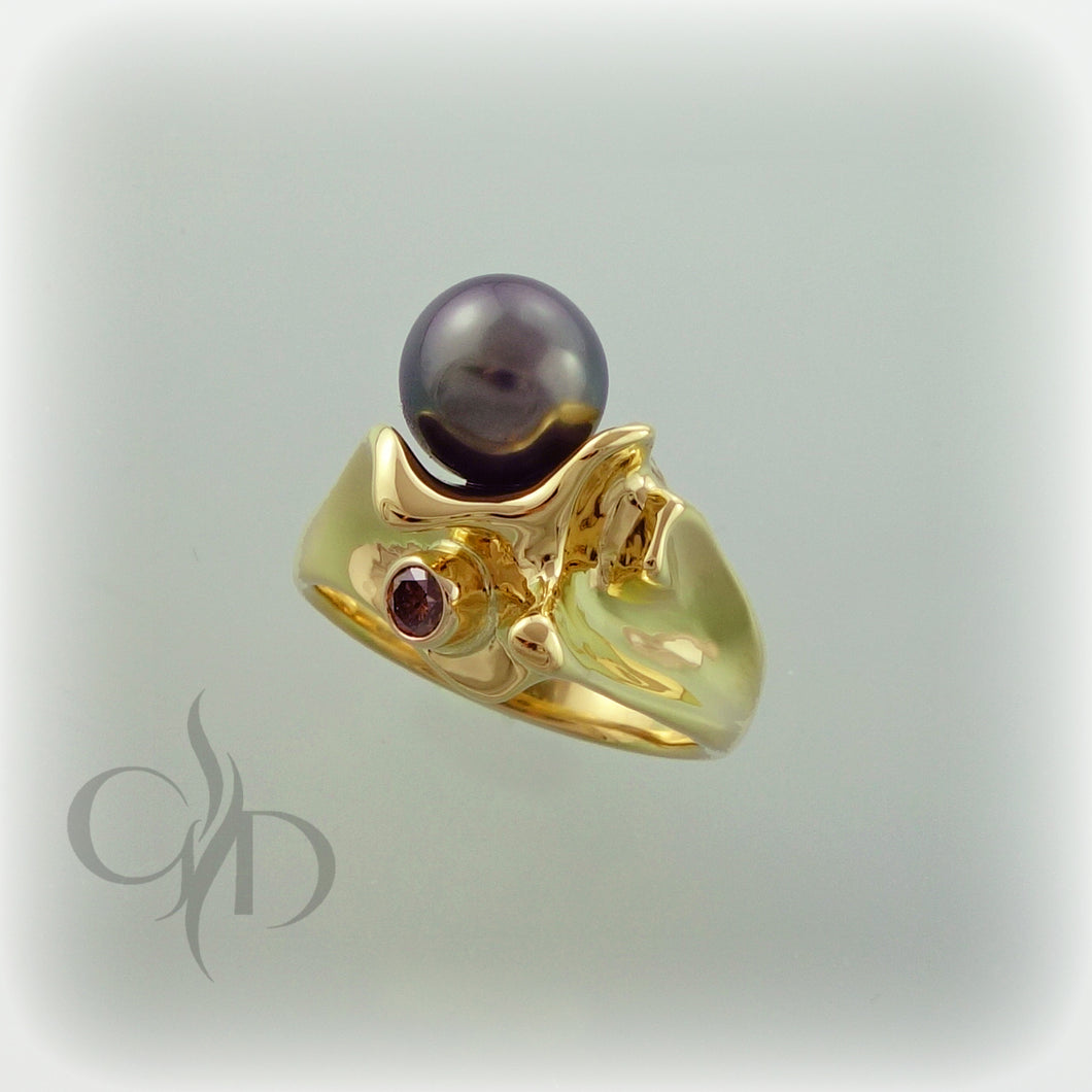 John Winters’ free form sculpted black pearl and cognac diamond ring